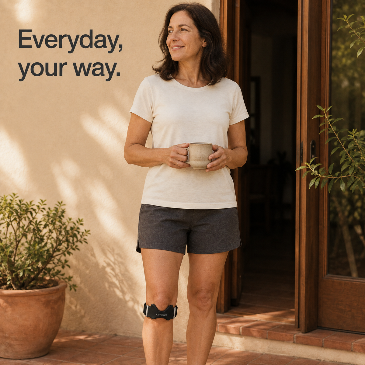 Woman wearing the Kynova strap on a patio